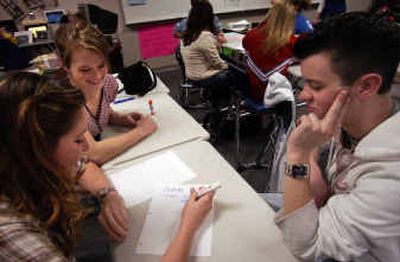 
Central Valley High senior Lindsey Wallingford, far left, and sophomore Maria Alderman suggest to their teammate, junior Johnny Guinn, that he could dress as a woman to spice up their presentation. Students in Leanne Donley's Associated Student Body class started training to help freshmen. 
 (Liz Kishimoto / The Spokesman-Review)
