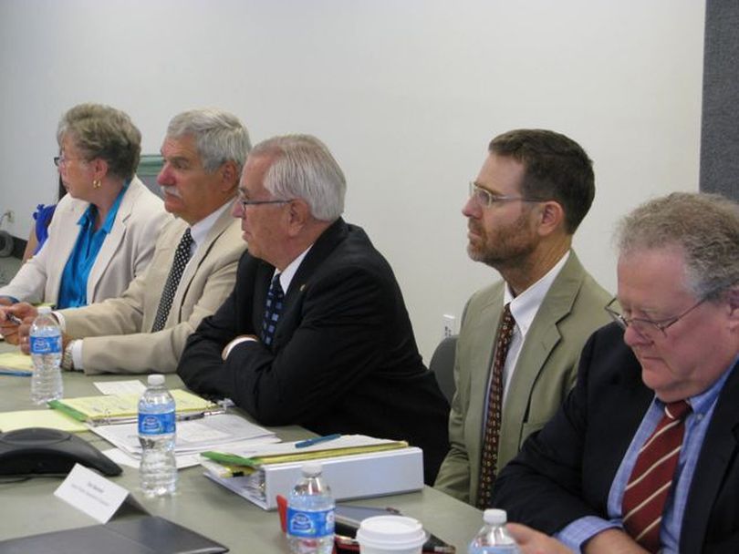 Bill Deal, center, in dark suit, director of the Idaho Department of Insurance, speaks Thursday at the first meeting of the governor's Health Insurance Exchange Working Group, which he chairs. At right is Rep. John Rusche, D-Lewiston; second from left is Sen. John Goedde, R-Coeur d'Alene. (Betsy Russell)