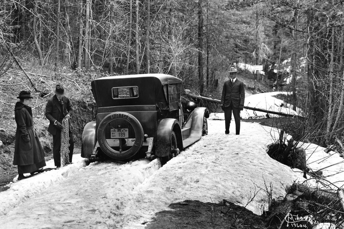 1921: In this photo by Charles Libby, motorists chain up their tires to get up Mount Spokane Park Drive. (The Eastern / The Spokesman-Review)