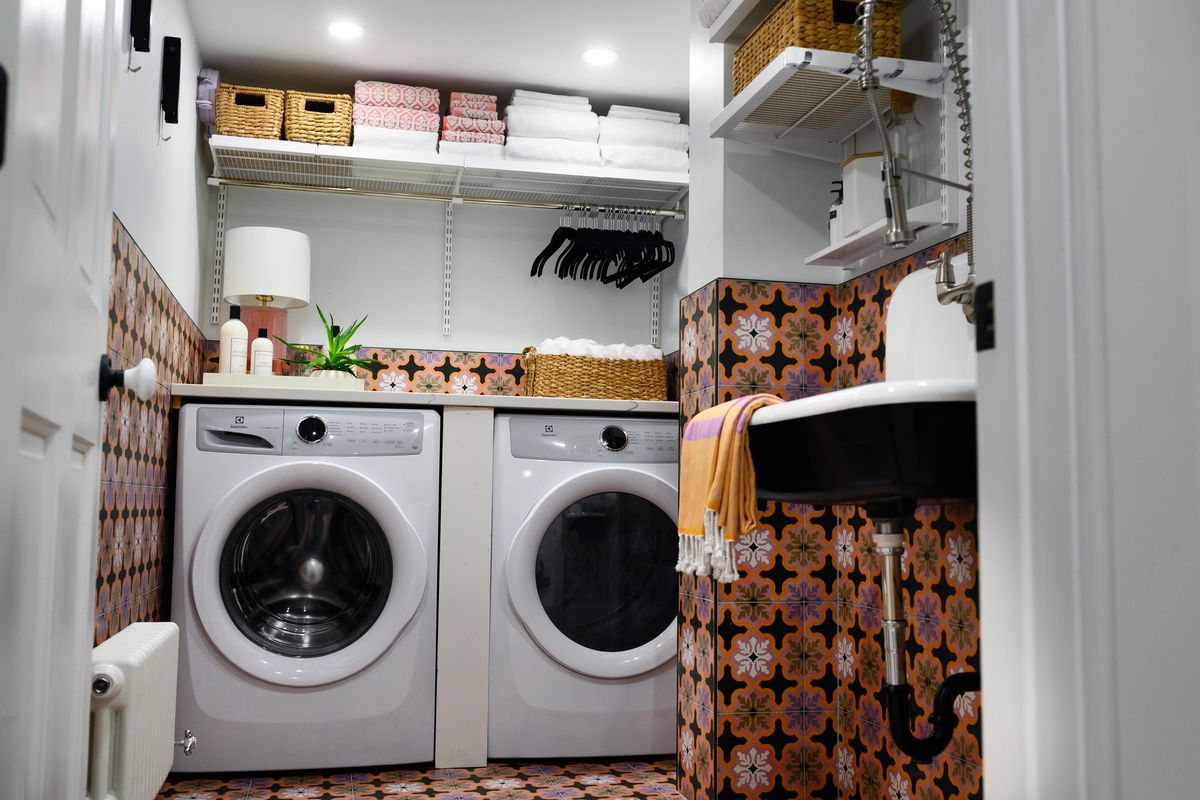 Jessica Centella and Kiera Kushlan of Residents Understood designed a cool laundry space as part of a total basement renovation, using encaustic porcelain tiles and a farmhouse-style cast-iron sink. (Sarah L. Voisin / Washington Post)