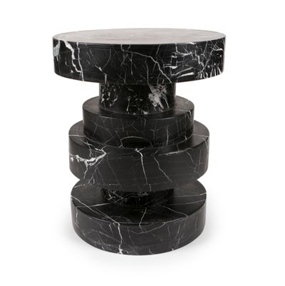 Kelly Wearstler’s Apollo stool is an artful stack of black or white marble circles. (Associated Press)