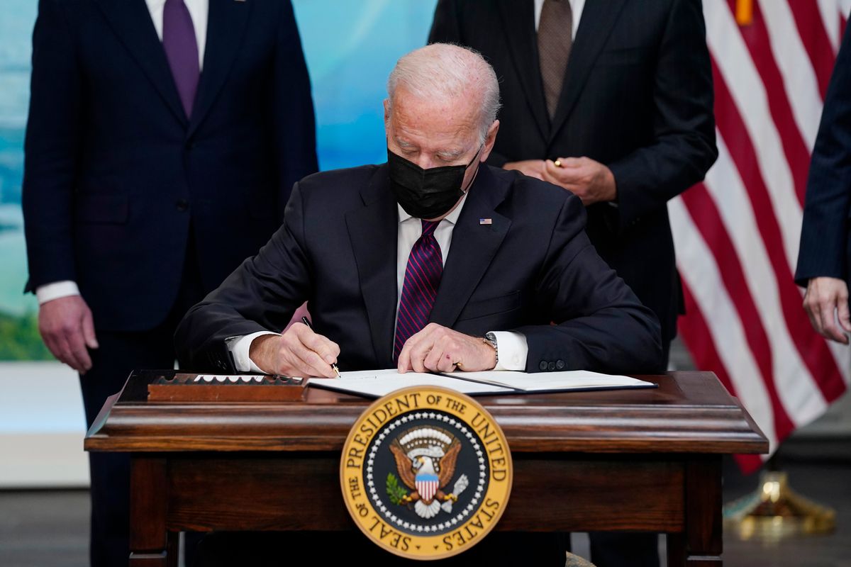 President Joe Biden signs an executive order to help improve public safety and justice for Native Americans during a Tribal Nations Summit during Native American Heritage Month, in the South Court Auditorium on the White House campus, Monday, Nov. 15, 2021, in Washington.  (Evan Vucci)