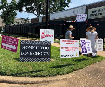 Abortion opponents kneel in prayer outside Reproductive Health Services, an abortion clinic in Montgomery, Ala., on May 17, 2019. U.S. District Judge Myron Thompson on Sunday, April 12, 2020, issued a preliminary injunction to prevent the state from forbidding abortions as part of a ban on elective medical procedures during the COVID-19 pandemic. (Blake Paterson / AP)