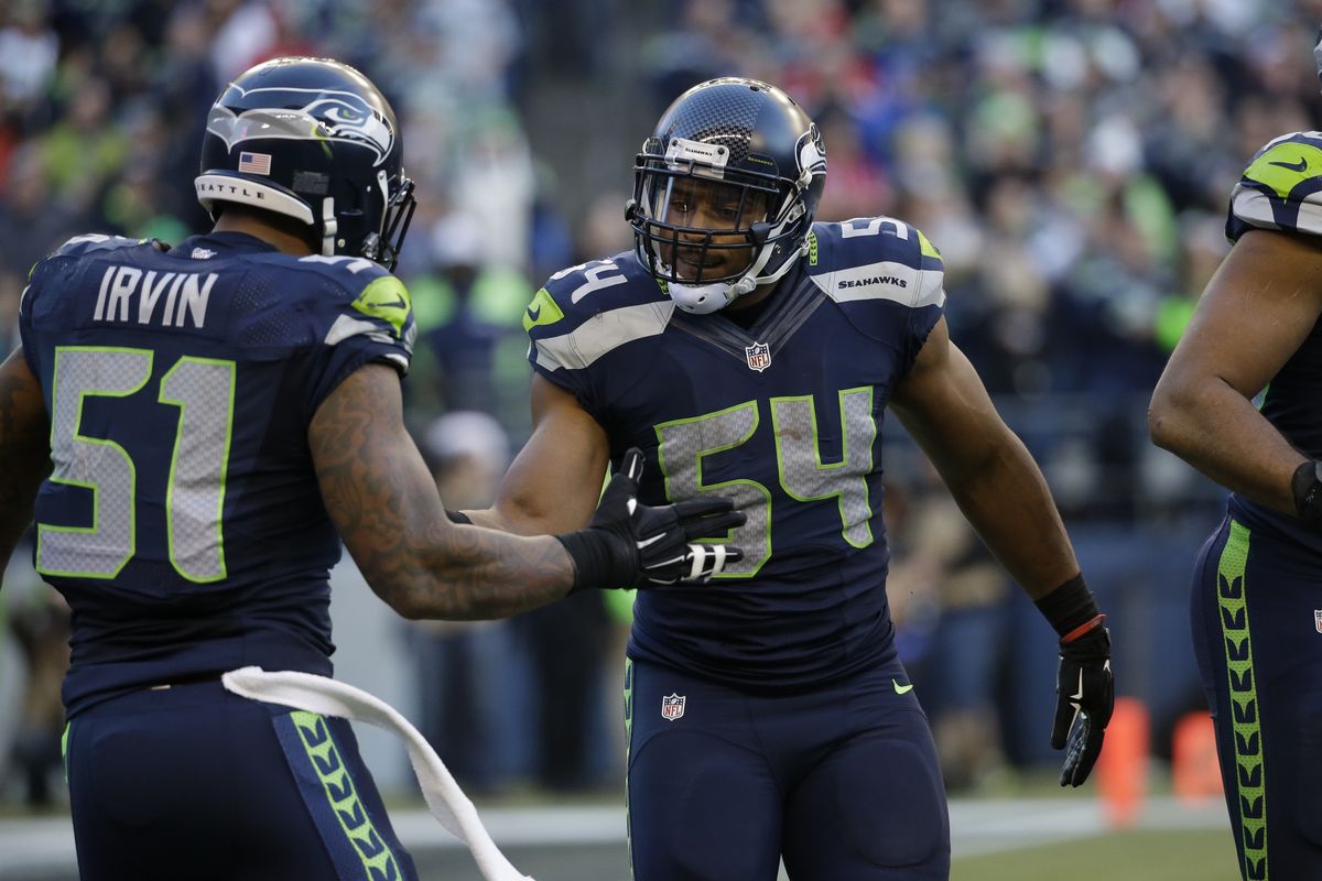 Linebackers Bruce Irvin and Bobby Wagner are crucial factors in a Seattle Seahawks defense that leads the league in fewest total yards and points allowed. (Associated Press)