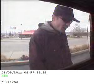 Police are asking for help in identifying a potential suspect in a residential burglary.
Surveillance photos at the Washington Trust Bank ATM on Sullivan Road in Spokane Valley captured images of a man in a black hat, dark glasses and jacket using the victim's credit card last Tuesday just before 9 a.m. 
The suspect arrived and left southbound on Sullivan on foot.
Anyone with information on the man's identity is asked to call Crime Check at (509) 456-2233 or Spokane Valley police Detective Mark Renz at (509) 477-3330. (Spokane Valley Police Department)