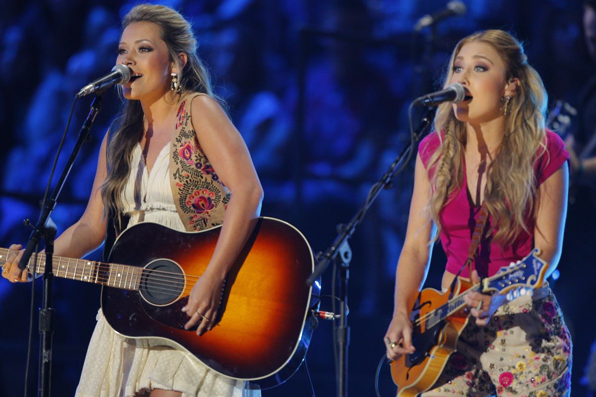 Tae Dye, left, and Maddie Marlow, of the musical group Maddie & Tae, perform at the CMT Music Awards in Nashville, Tenn. Only three songs with female voices are in the current Top 25 of Billboard’s Hot country songs chart with Little Big Town’s “Girl Crush,” Cam’s “Burning House” and Maddie & Tae’s “Fly.” (Associated Press)