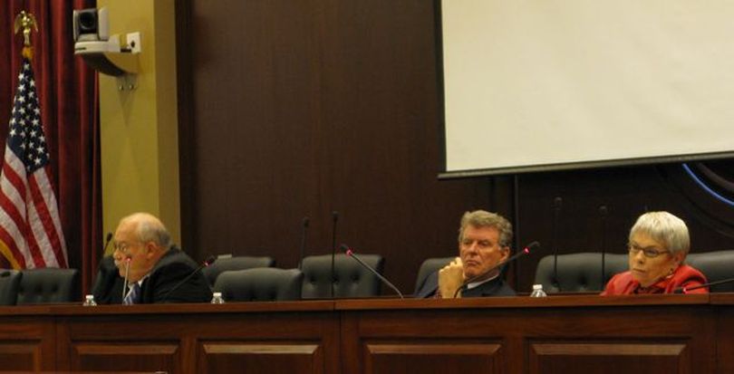 Idaho Gov. Butch Otter, center, chairs the Idaho Land Board on Tuesday as it discusses state-owned cabin sites. At right is state Controller Donna Jones; at left is Secretary of State Ben Ysursa. (Betsy Russell)