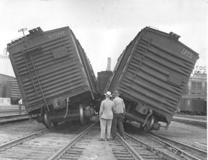 From the Sept. 9, 1946 edition of the Spokesman-Review: Squeeze Play. This is what happened when two freight cars has an "argument" this morning near the Northern Pacific station. Railroad officials said a crew had "kicked" one car up one track and that it backed down and cornered a car on another track near the switch. A pair of trucks was derailed. No one was injured and damage was negligible.  (Photo Archives/The Spokesman-Review)