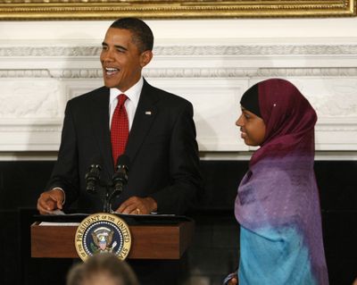 President Barack Obama introduces Bilqis Abdul-Qaadir, who set the career points record in girls  basketball for Massachusetts.  (Associated Press / The Spokesman-Review)