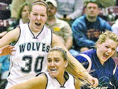 
Lake City's Alison Vaughan (55), Arica Johnson (30) and Brittany Bemis (12) storm the court after the championship win. 
 (Matt Cilley Special to / The Spokesman-Review)