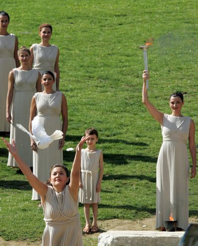 An  actress releases a pigeon during the lighting ceremony in Greece for the Vancouver 2010 Winter Games.  (Associated Press / The Spokesman-Review)