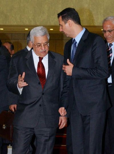 
Syrian President Bashar Assad, right, talks with Palestinian leader Mahmoud Abbas in Damascus on Saturday. 
 (Associated Press / The Spokesman-Review)