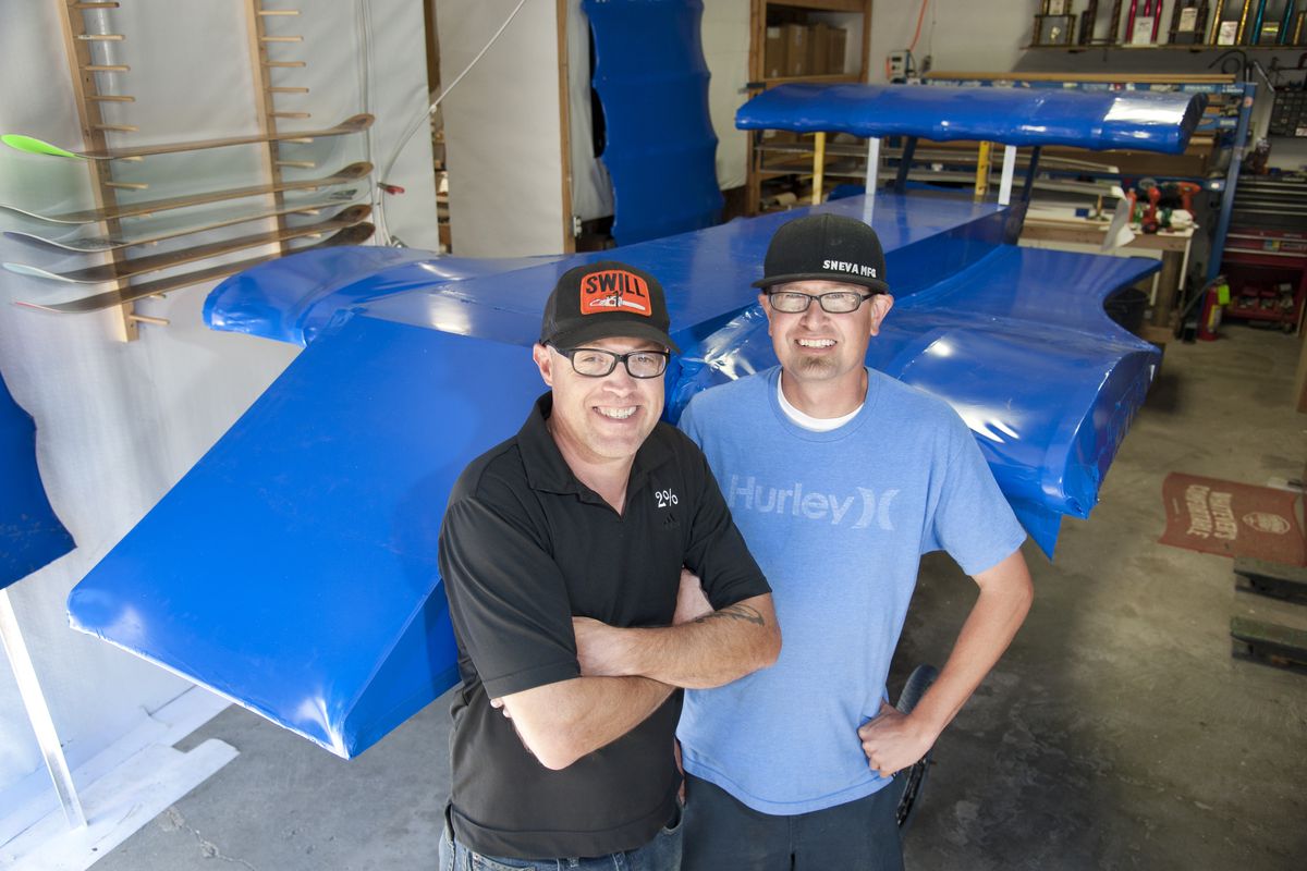 Bryce Rich and TJ Sneva proudly display their Red Bull Flugtag, a man-powered craft they hope will take flight – with a pilot dressed in squirrel costume. (Dan Pelle)