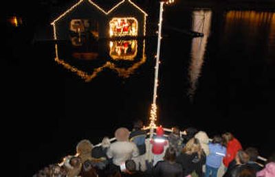 
Kids and families crowd to the prow of the Mish-A-Nock cruise boat to see Santa and Mrs. Claus inside a  boathouse at Casco Bay on Lake Coeur d'Alene.
 (JESSE TINSLEY/THE SPOKESMAN-REVIEW / The Spokesman-Review)