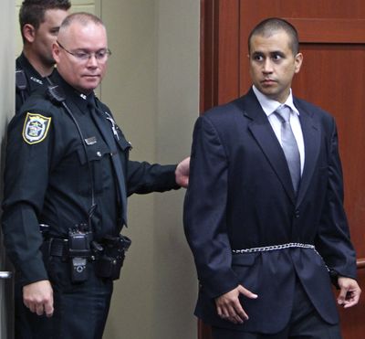 George Zimmerman, right, enters the courtroom Friday during a bond hearing in Sanford, Fla. (Associated Press)