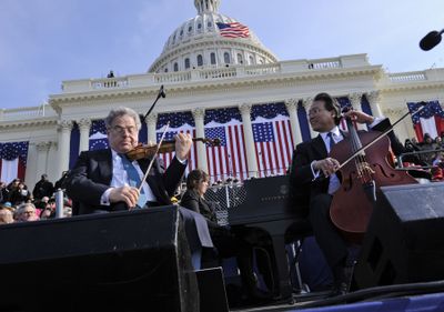 Violinist Itzhak Perlman, left, and cellist Yo-Yo Ma perform to recorded music during the inauguration ceremony Jan. 20 of President Barack Obama. (Associated Press / The Spokesman-Review)