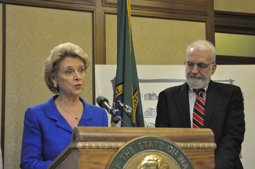 Gov. Chris Gregoire and OFM Director Marty Brown unveil the proposed 2011-13 state budget in Olympia on 12/15/2010 (Andrew Zahler)