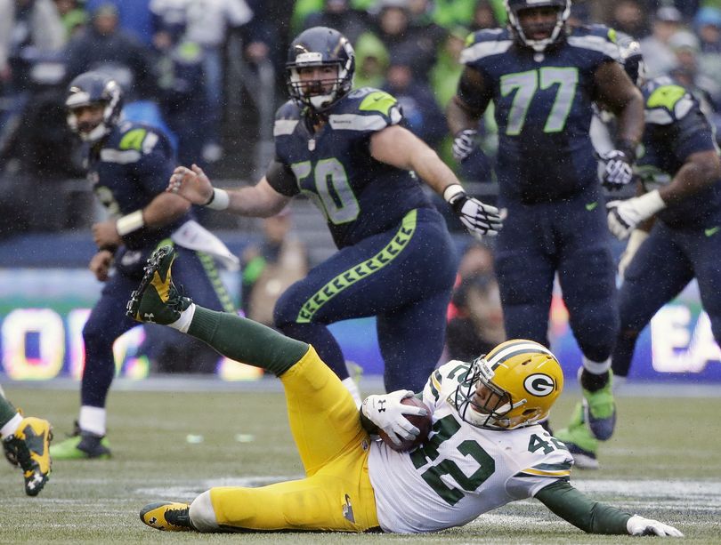 The Packers were all but headed to the Super Bowl when Morgan Burnett slid to the turf with his fourth-quarter interception. (Associated Press)