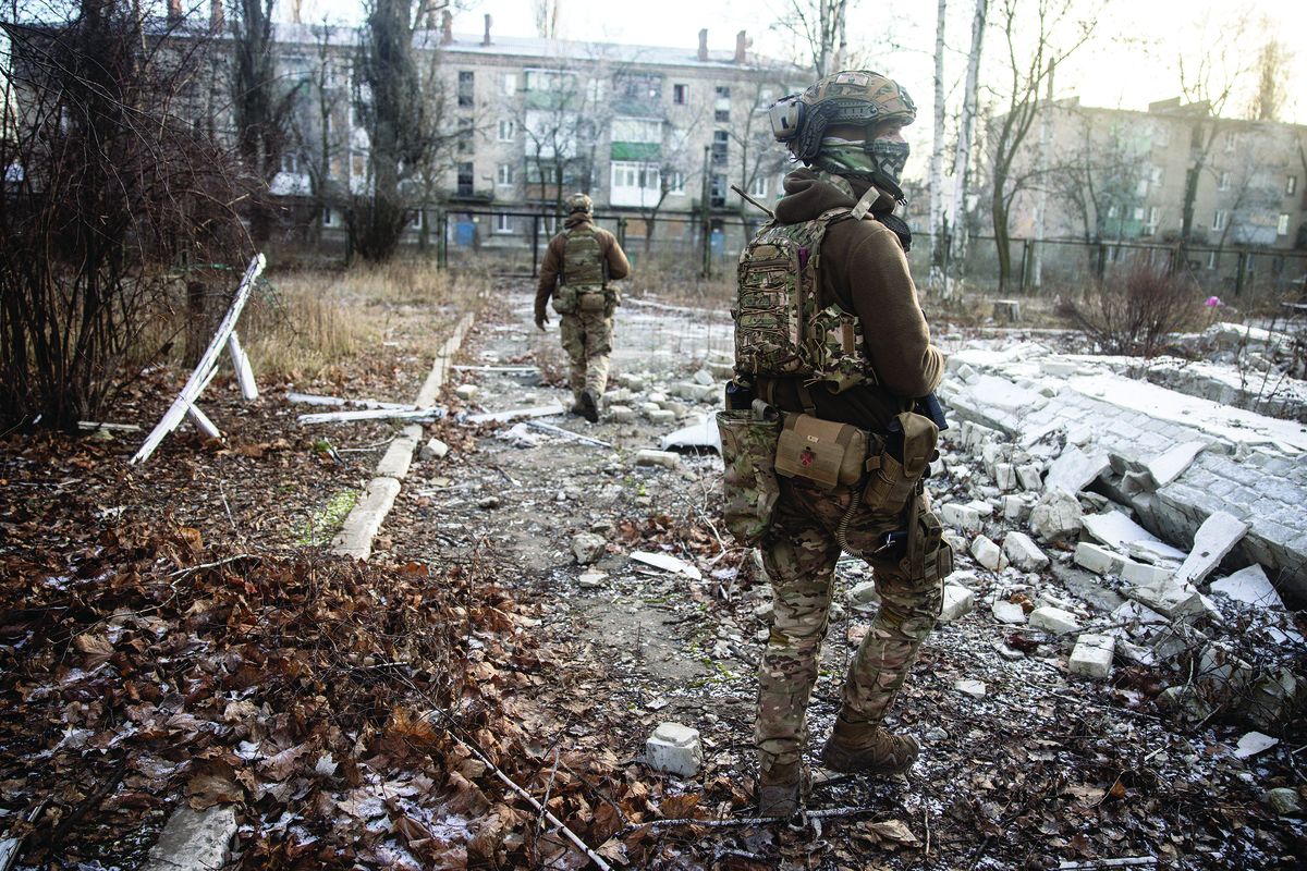 Members of the Ukrainian 110 Separate Mechanised Brigade during a patrol in Avdiivka, Ukraine, on Dec. 20, 2022.  (Chris McGrath)