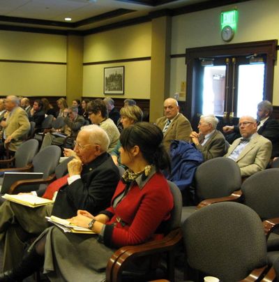 Rep. Frank Henderson, at left in foreground, listens to the House Education Committee debate his bill Thursday morning to expand community college boards; the colleges strongly opposed the bill, and the committee killed it. (Betsy Russell)