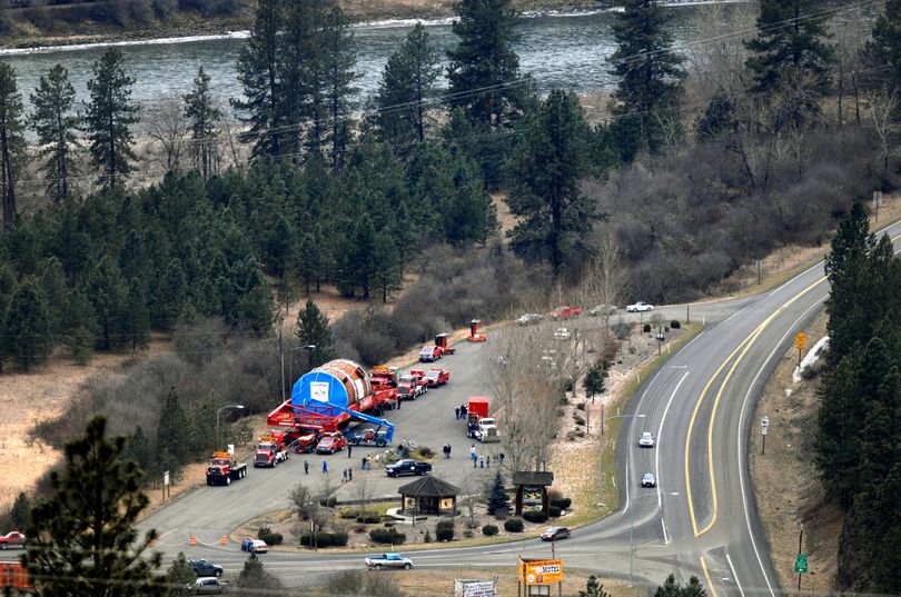Parked between the Clearwater River and U.S. Highway 12 at Kooskia, Idaho, on Feb. 3, the first megaload of a ConocoPhillips half-drum awaits the next leg of its journey to Billings. (Associated Press / Lewiston Tribune)