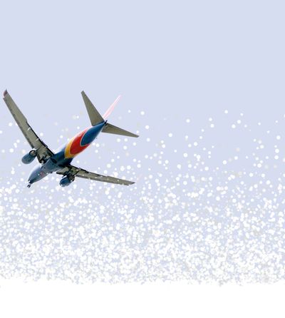 A Southwest Airlines flight arrives to Reagan National Airport, Monday, Dec. 27, 2021, in Arlington, Va., from Gravelly Point across the river from Washington. (AP Photo/Jacquelyn Martin) ORG XMIT: VAJM104  (Jacquelyn Martin)