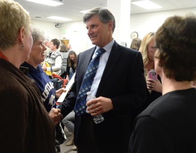 Just after he was fired by the Spokane Valley City Council, City Manager Mike Jackson accepts the condolences of citizens and city staff after the city council meeting Tuesday, Feb. 23, 2016. (Jesse Tinsley / The Spokesman-Review)