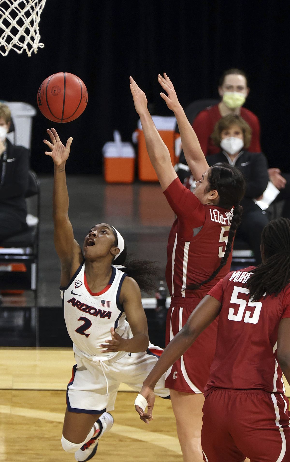 Arizona guard Aari McDonald (2) shoots as Washington State guard Charlisse Leger-Walker (5) defends during the first half of an NCAA college basketball game in the second round of the Pac-12 women