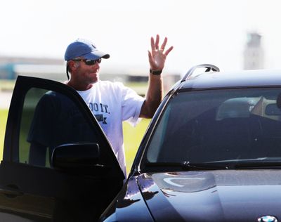 Brett Favre greets fans after arriving in Eden Prairie, Minn.  (Associated Press)