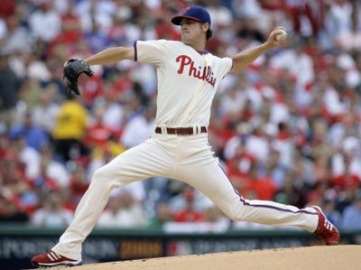 Philadelphia starter Cole Hamels pitched the Phillies to their first postseason win in 15 years.  (Associated Press / The Spokesman-Review)