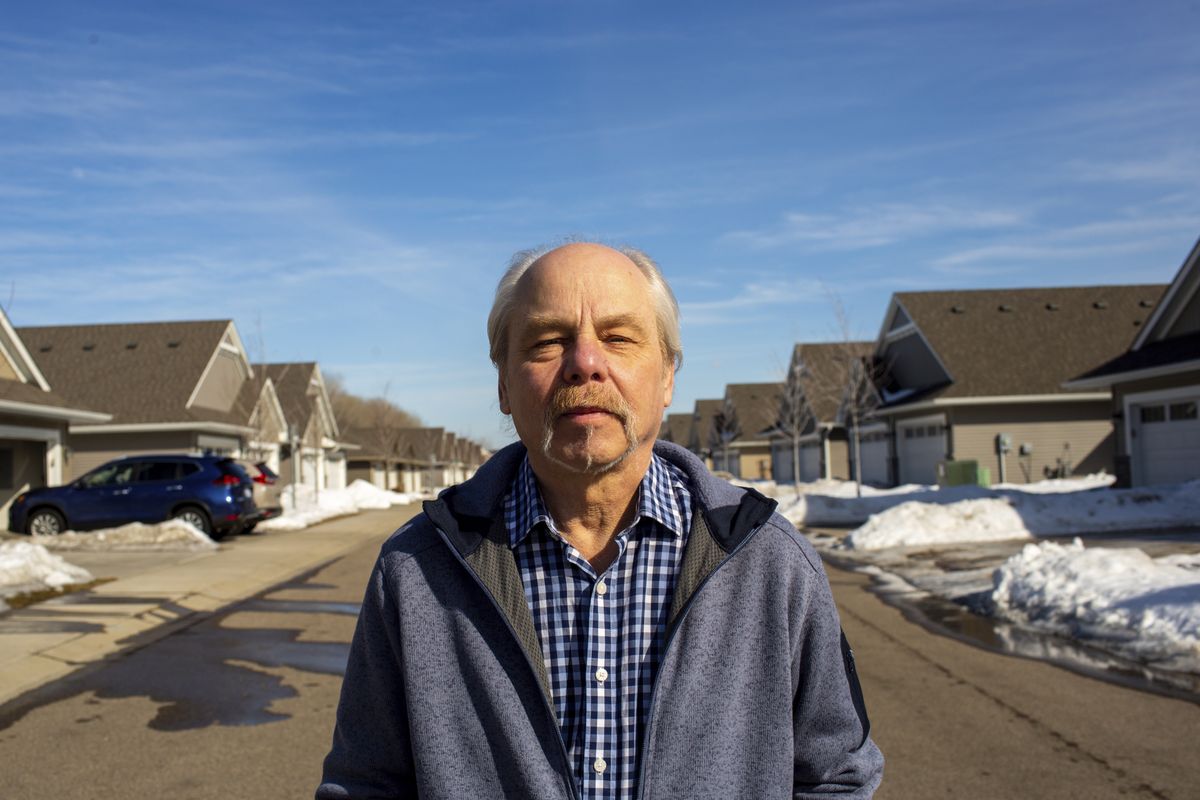 Jeffrey Carlson stands for a portrait outside his home in Vadnais Heights, Minn., on Sunday, March 13, 2022. Carlson, a Type 1 diabetic with heart stents, contracted COVID-19 in January, but recovered quickly after being treated with Merck