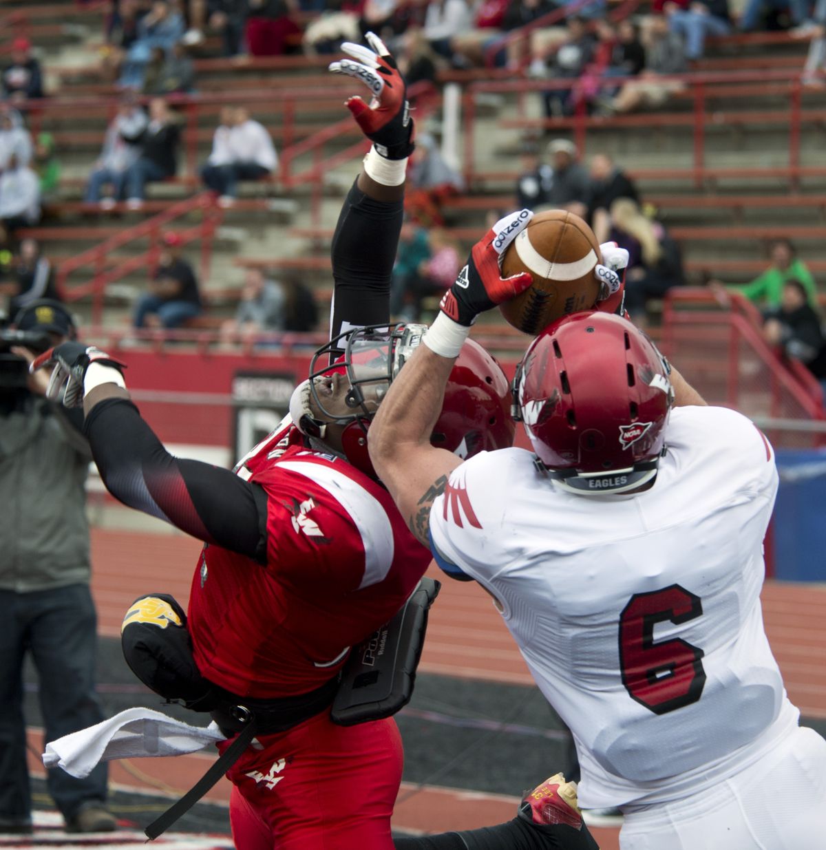 Eastern Washington wide receiver Cory Mitchell hauls in a touchdown pass over the defense of T.J. Hill. (Dan Pelle)