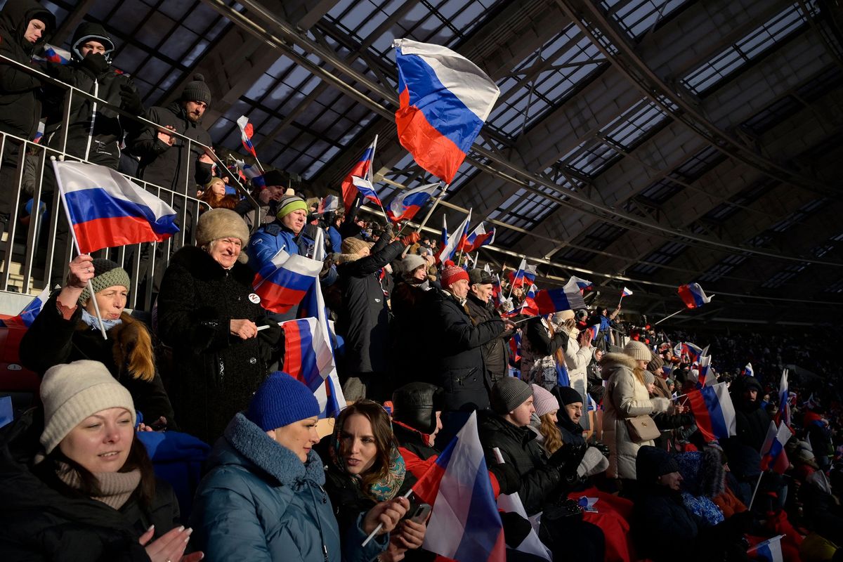 People attend a patriotic concert dedicated to the upcoming Defender of the Fatherland Day at the Luzhniki stadium in Moscow on Wednesday.  (Natalia Kolesnikova/GETTY IMAGES EUROPE/TNS)