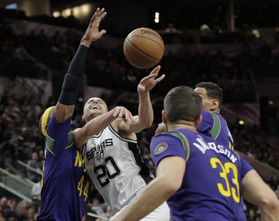 San Antonio guard Manu Ginobili, center, provides spark off bench for Spurs. (Eric Gay / Associated Press)