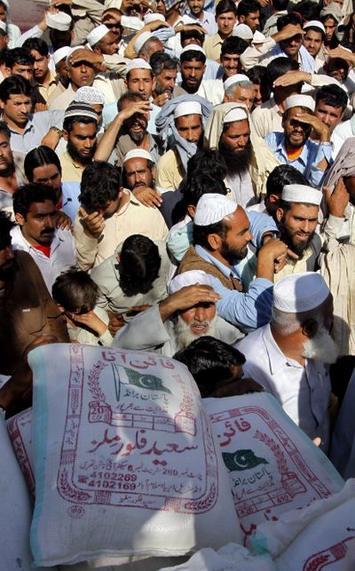 People internally displaced from Swat Valley wait their turn at a relief camp arranged by a Pakistani political party in Mardan, Pakistan, on Sunday.  (Associated Press / The Spokesman-Review)