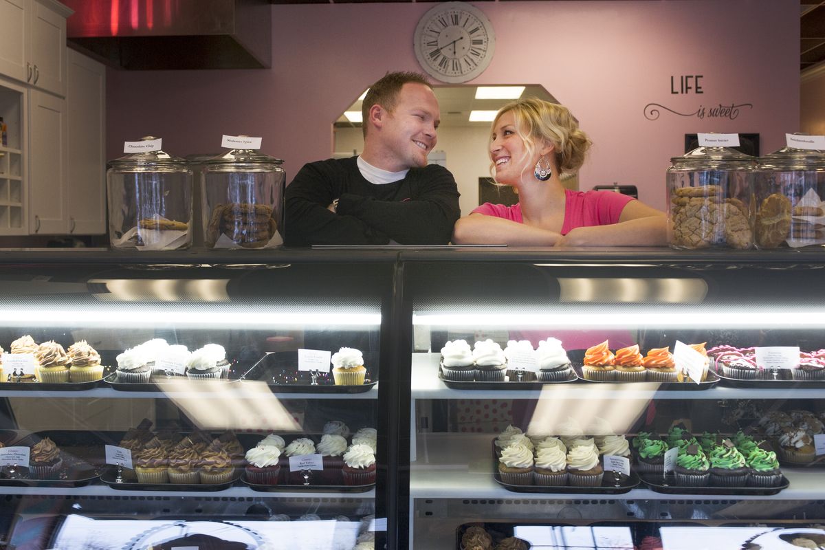 Joe and Amber Owens smile at each other at their new Spokane Valley location for Celebrations Bakery on Nov. 14. Their first bakery is at 713 W. Garland Ave. (Tyler Tjomsland)