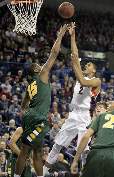 GU’s Angel Nunez elevates in the paint to shoot over the Dons’ Kruize Pinkins. (Jesse Tinsley)