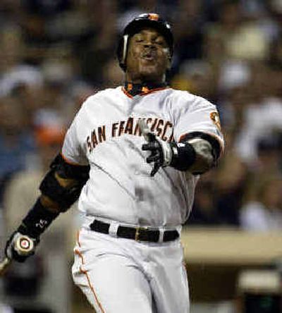 
San Francisco slugger Barry Bonds knows he'll at least remain a Giant through next season. 
 (Associated Press / The Spokesman-Review)