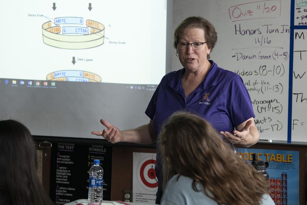 Rogers High School biomedical science teacher Carol Kaplan preps students on a DNA exercise in class on Friday. (COLIN MULVANY/The Spokesman-Review)