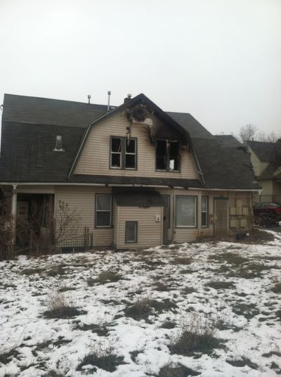 A two alarm fire caused $100,000 in damage to this home converted to apartments at 1024 W. Boone Ave. on Feb. 28, 2014.  (Nina Culver)