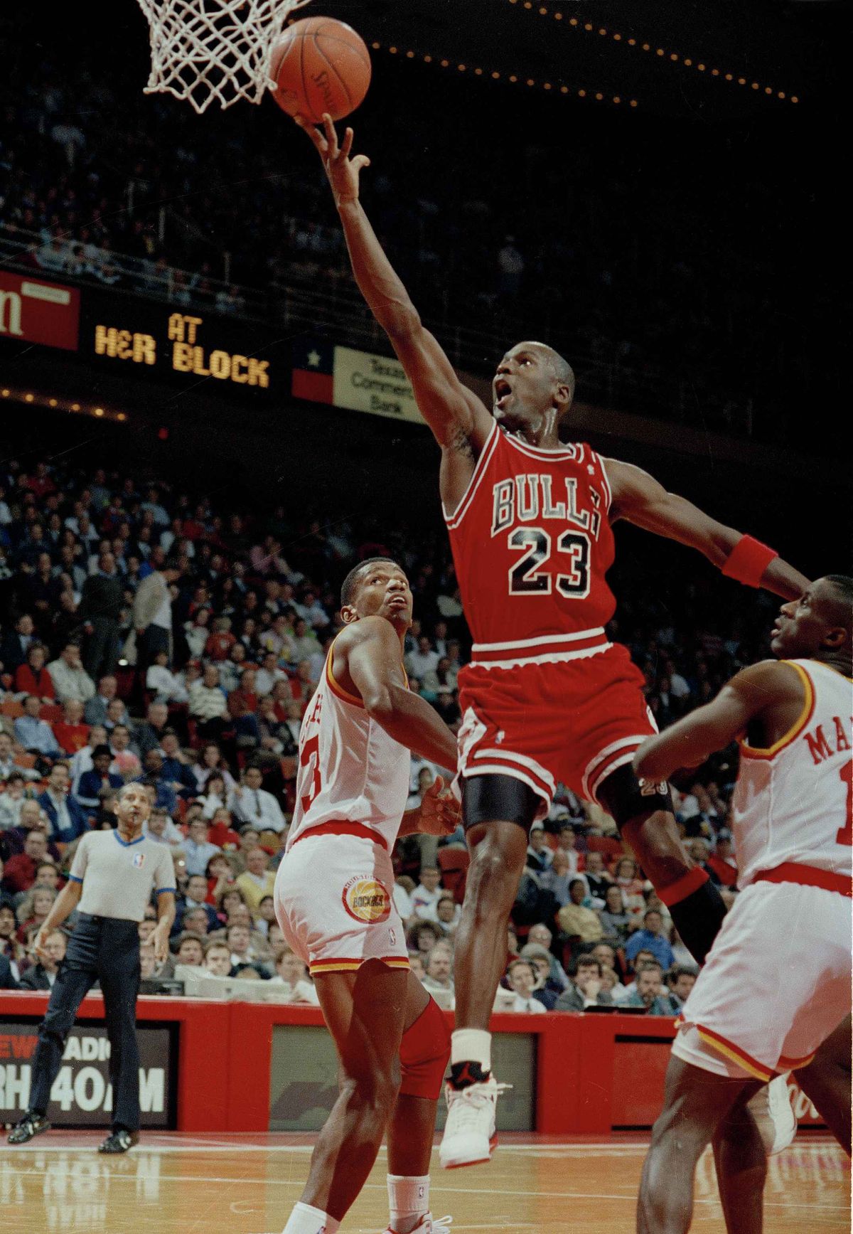 In this Jan. 3, 1991 photo, Michael Jordan (23) of the Chicago Bulls drives the lane for a finger roll lay-up in Houston, Texas. Picking the car number for Michael Jordan's new NASCAR team was a slam dunk: Bubba Wallace will drive the No. 23 car when the team makes its debut next season.  (Associated Press)