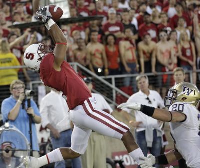 Stanford wide receiver Drew Terrell (4) catches TD pass in front of Washington safety Justin Glenn. (Associated Press)