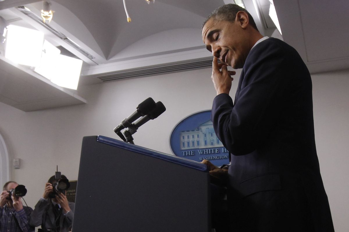 President Barack Obama wipes his eye as he speaks about the school shooting in Newtown, Conn., Friday, Dec. 14, 2012, in the briefing room of the White House in Washington. (Charles Dharapak / Associated Press)