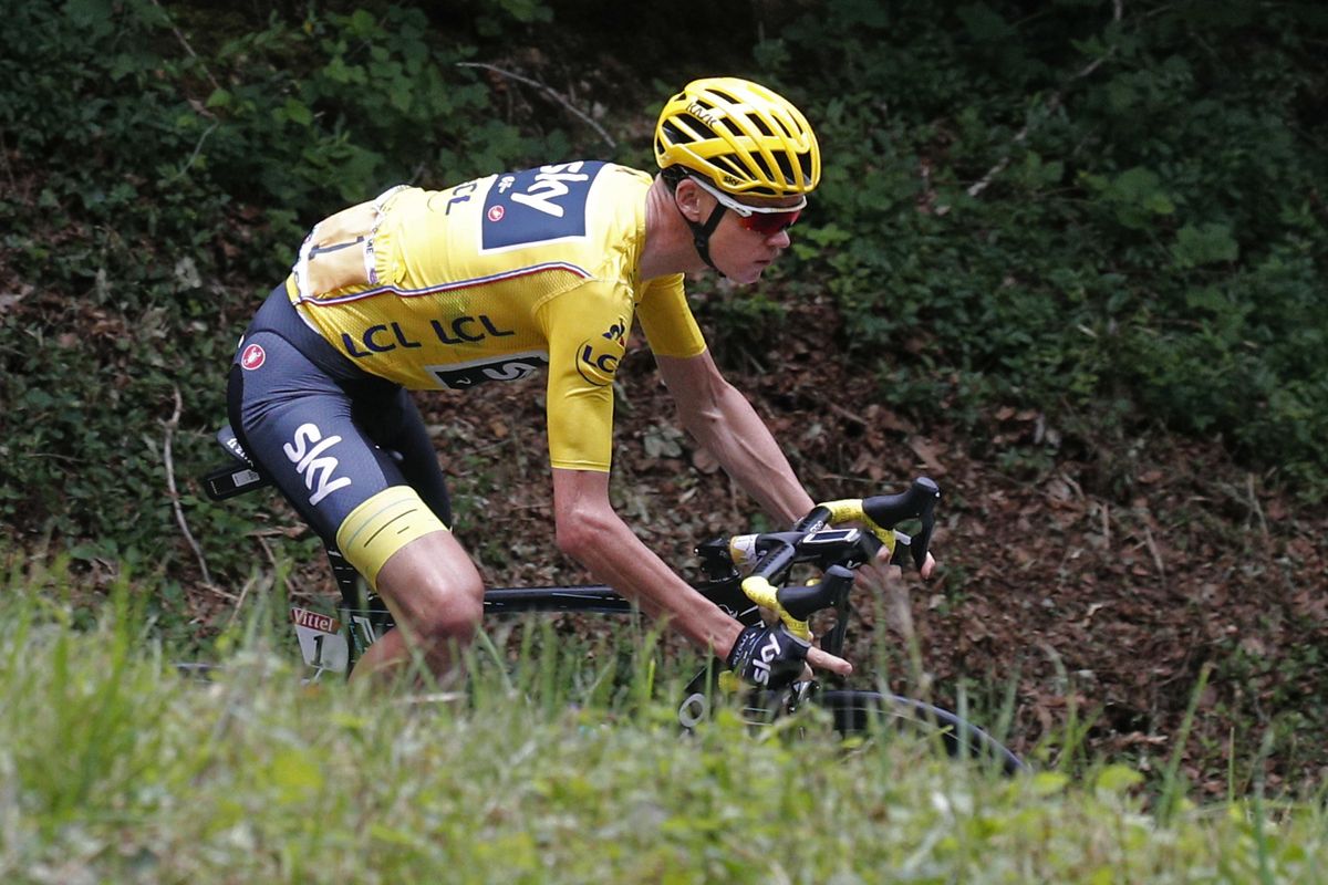 In this July 9, 2017 file photo, Britain’s Chris Froome, wearing the overall leader’s yellow jersey, speeds downhill during the ninth stage of the Tour de France cycling race over 112.8 miles with start in Nantua and finish in Chambery, France. (Christophe Ena / Associated Press)