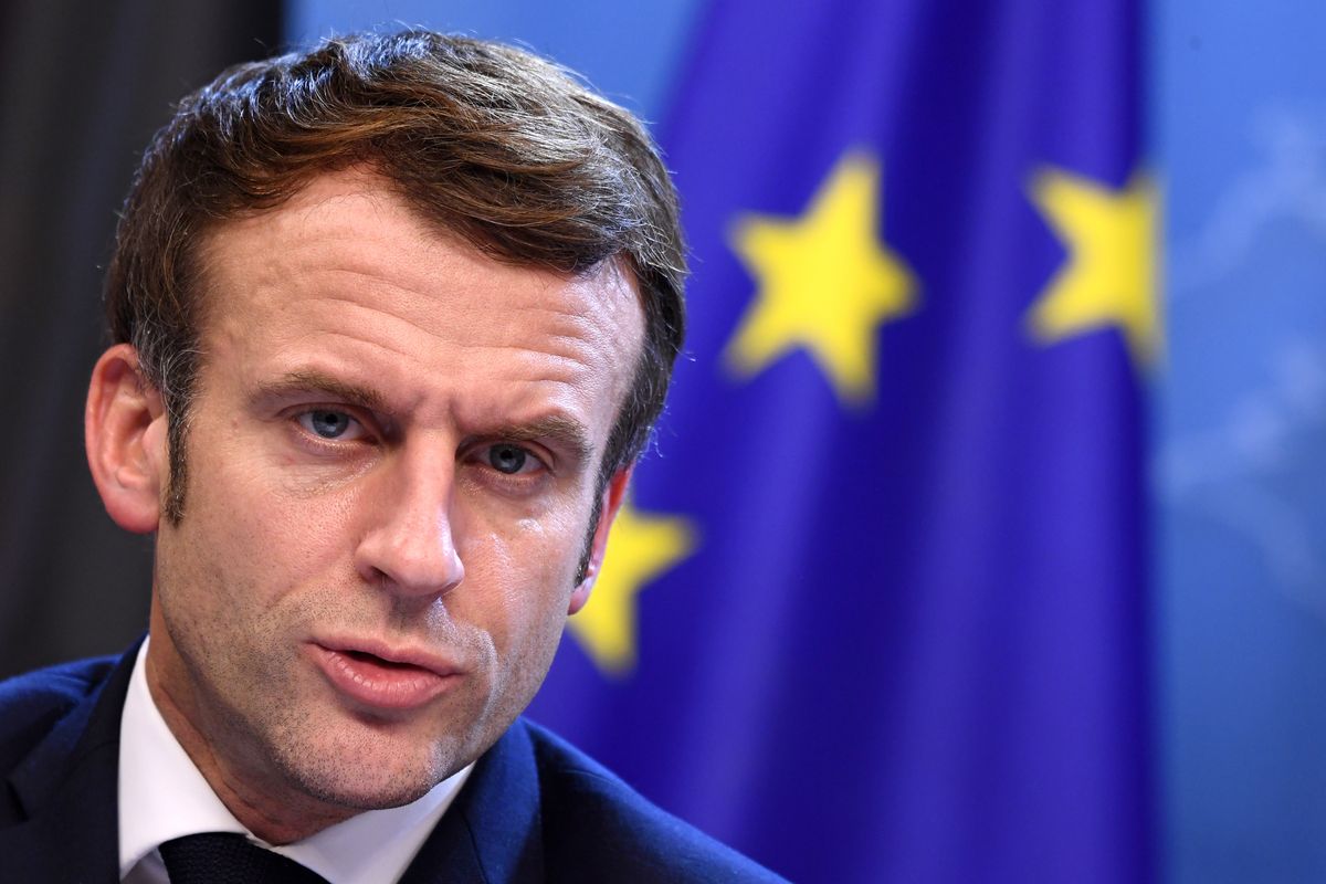 FILE- French President Emmanuel Macron addresses a media conference at the conclusion of an EU Summit in Brussels, Friday, Dec. 17, 2021. President Emmanuel Macron has provoked outcries in parliament and shrill protests from election rivals by using a vulgarity to describe his strategy for pressuring vaccine refusers to get coronavirus jabs.  (John Thys)