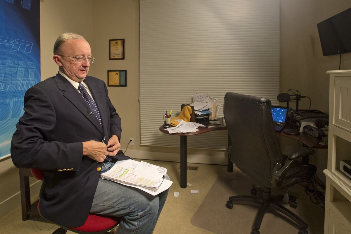 John Clayton gets ready to appear in his next ESPN segment in his home studio in Renton, Wash.