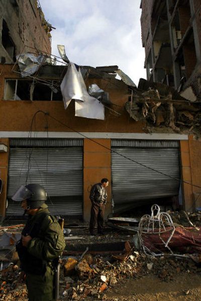 
A Bolivian police officer stands guard in front of the motel Riosinio in La Paz , Bolivia, on Wednesday.
 (Associated Press / The Spokesman-Review)