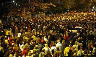 
Demonstrators protest outside the Russian Embassy in Helsinki, Finland, Sunday to demand a full investigation into the killing of journalist Anna Politkovskaya. 
 (Associated Press / The Spokesman-Review)