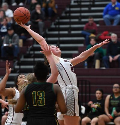 Mt. Spokane forward Gracey Neal (20) shoots the ball against Shorecrest during a girls 4A regional high school basketball playoff game, Friday, Feb. 28, 2020, at University High School. (Colin Mulvany / The Spokesman-Review)