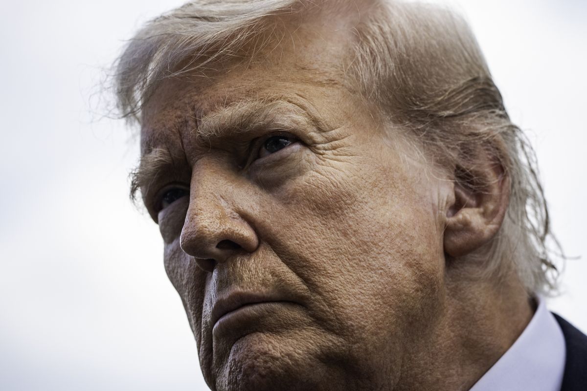 President Donald Trump speaks to members of the press before boarding Marine One on Thursday at the White House. (Salwan Georges/The Washington Post)